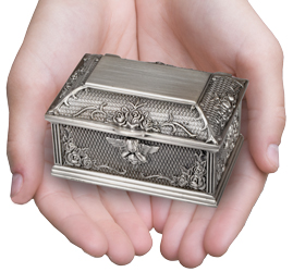 guardian angel urn keepsake shown in hand for size scale