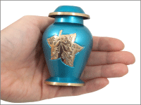 blue falling leaves small keepsake shown in hand for size comparison
