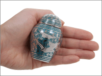 <fly away small keepsake shown in hand for size scale>