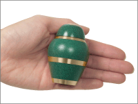 scarlet small keepsake urn shown in hand for size comparison