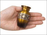 sunset small keepsake urn shown in hand for size comparison