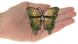 Shades of Peridot Butterfly Cremation Keepsake shown in hands