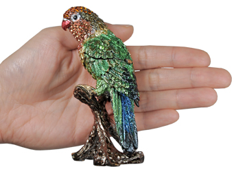 parrot cremation urn keepsake shown with hand for size scale