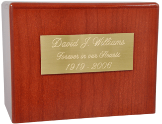 engraved large brass finish plaque shown on wood urn
