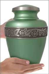 Jade Green Classic Cremation Urn shown in hands for size scale