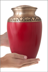 Cherry Red Cremation Urn shown in hand for size