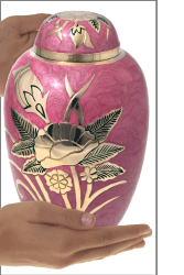 golden flowers on rose pink shown in hands for size relation