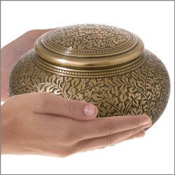 Enchanted Vines Sharing Urn shown in hands for size reference