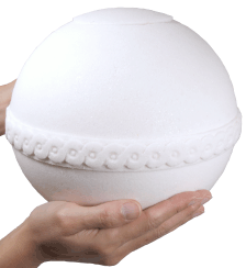 biodegradable nu urn shown in hands for size scale