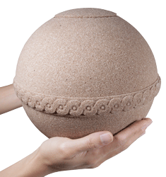 samsara biodegradable urn shown in hands for size scale