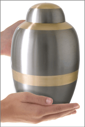 Traditional Two-tone Brass Cremation Urn shown in hand for size scale