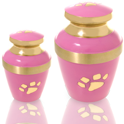 small and large pink pet cremation urn with brass paw print
