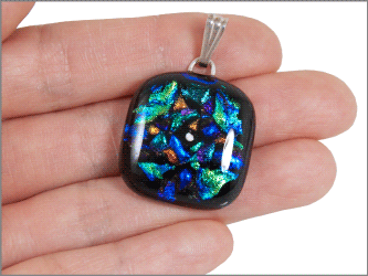 dichroic glass square pendant shown in hand for size scale
