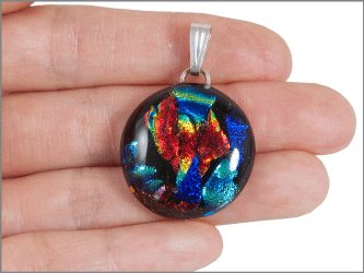 pendant shown in hand for size scale