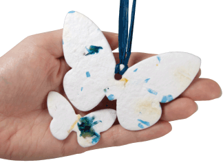 plantable memorials small and large butterfly shown in hand for size scale